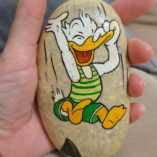 Hand-painted stone with Donald, new