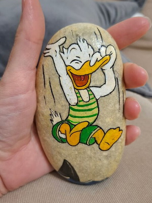 Hand-painted stone with Donald, new