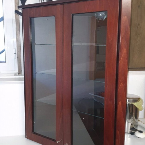 Corner showcase furniture like new with 3 shelves, 2 doors and spotlights