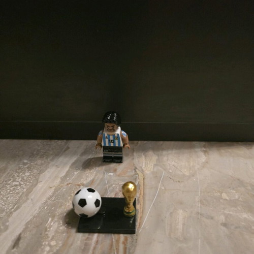 Diego Maradona collectible figure with World Cup trophy like new
