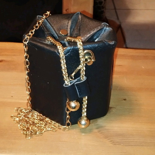 Modern pouch bag like new, black and gold