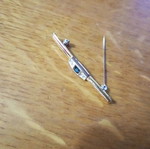 Jewelry pin like new, gold color with blue and clear stones