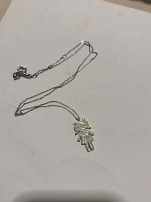 Swarovski necklace new, silver color, with girl pendant