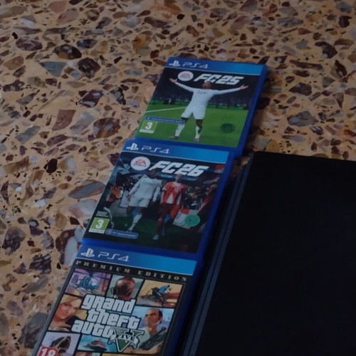 PS4 Pro console with 3 games and 2 controllers