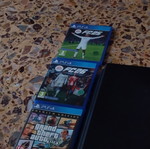 PS4 Pro console with 3 games and 2 controllers