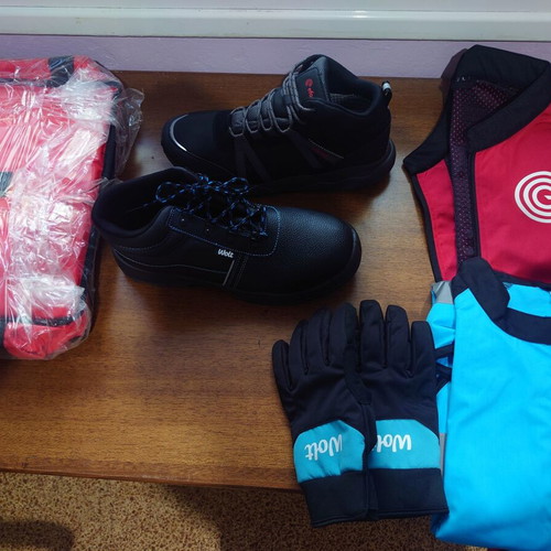 Delivery equipment set new with efood and Wolt shoes, gloves, jacket, and accessories