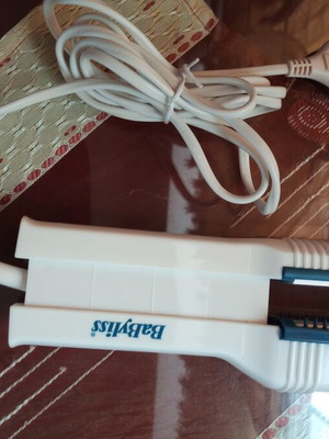 Hair straightener with water spray
