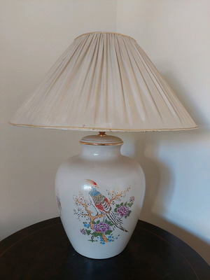 Table lamp used with worn lampshade