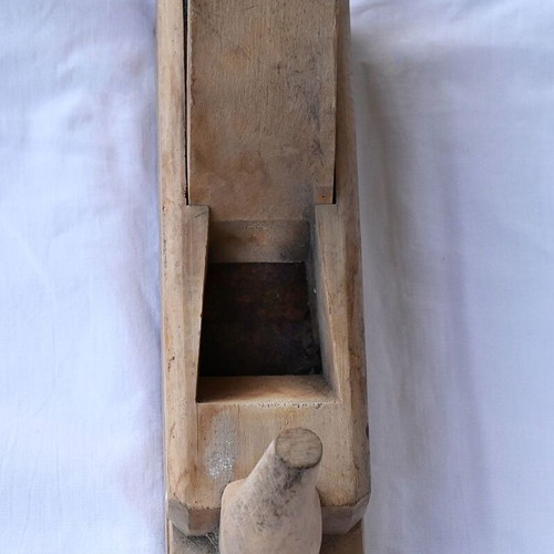 Wooden plane used with horn handle and adjustable blade depth