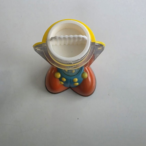 Vintage clown coin bank with yellow coin tube