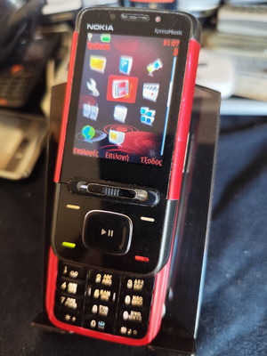 Nokia 5610 XpressMusic phone used with charger
