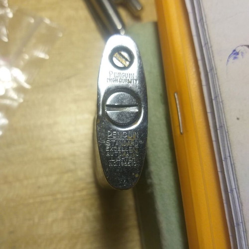 Penguin petrol lighter used, collectible