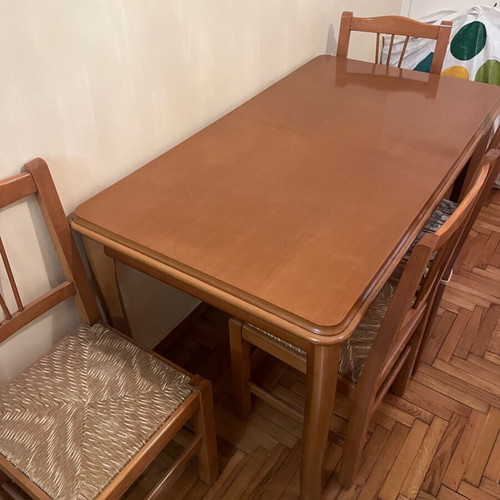 Wooden dining set used with 4 chairs and wicker seats