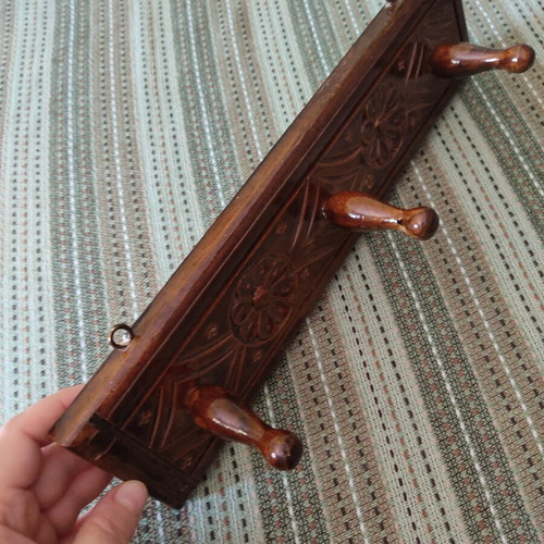 Vintage carved wooden coat rack with three hooks
