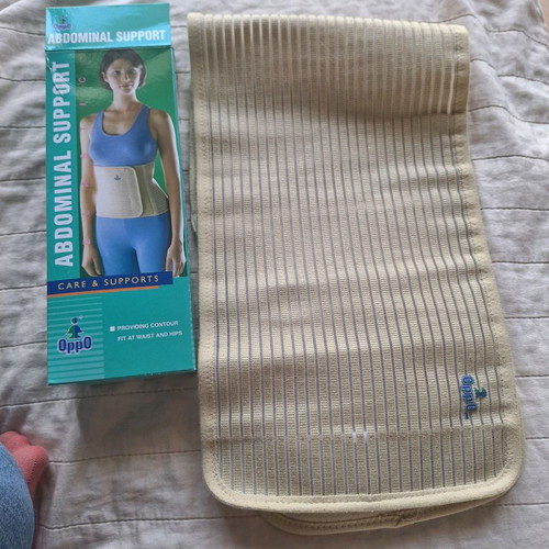 Postoperative abdominal support belt used, size M
