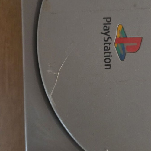 Sony PlayStation 1 console used with memory card, controller, and game