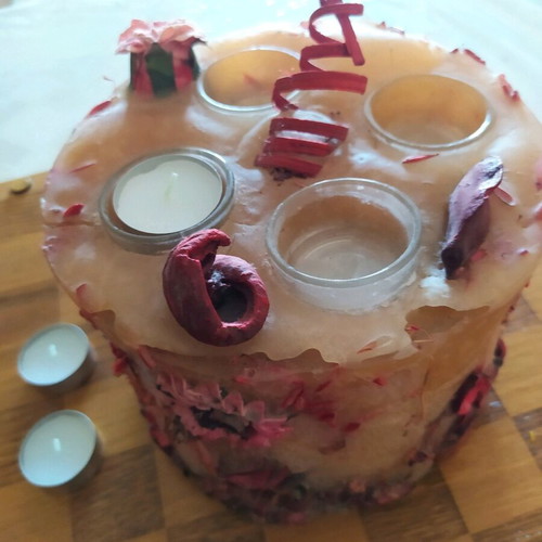 Decorative candle with dried flowers used