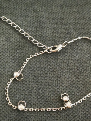 Silver bracelet with designs and strass like new
