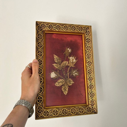 Vintage embroidery framed on velvet