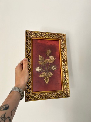 Vintage embroidery framed on velvet