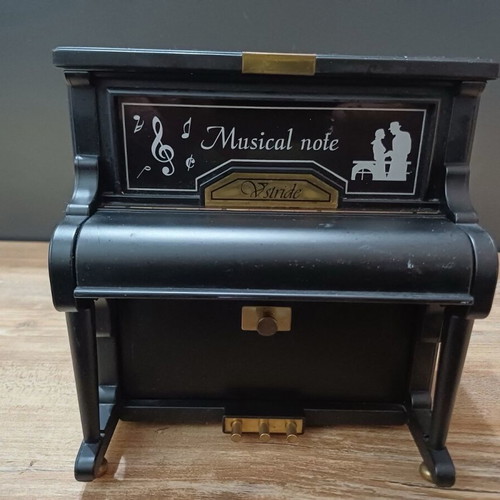Piano music box used with compartments for small jewelry plastic