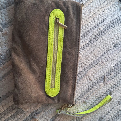 Leather wristlet bag with fluorescent details, Italy