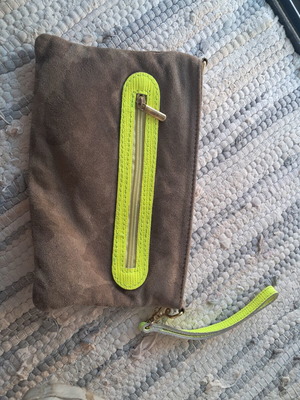 Leather wristlet bag with fluorescent details, Italy