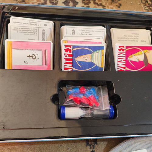 The Battle of the Sexes board game used with worn cards