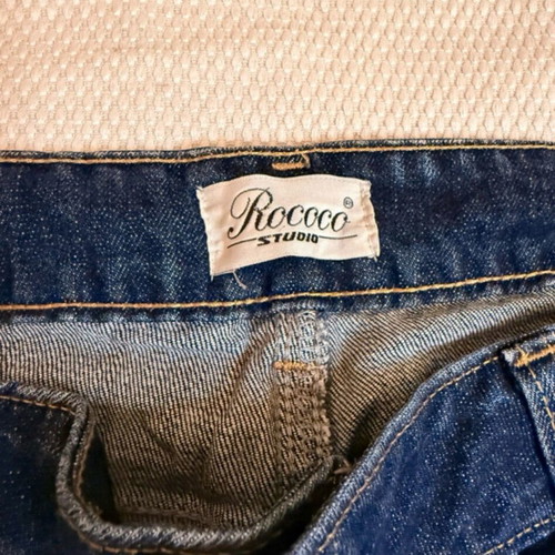 Vintage blue Rococo jeans with studs and rips like new