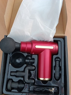 Massage gun new with four attachments and six speeds