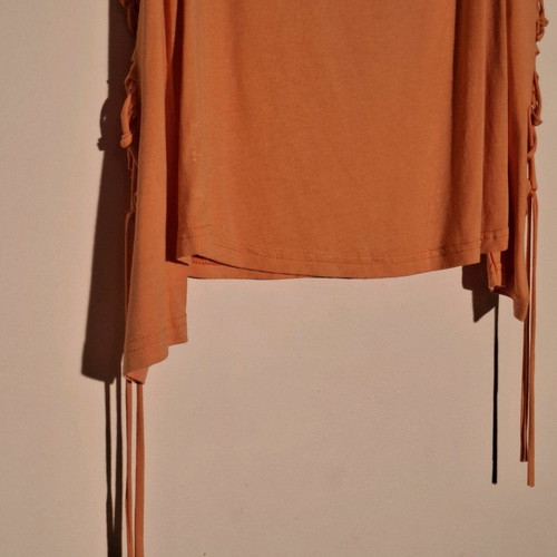Orange shirt like new with knitted holes on sleeve