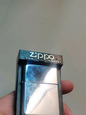 vintage stripped silver zippo in original packaging