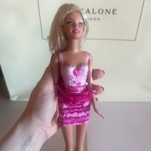 Mattel Barbie Beach doll with pink swimsuit and fuchsia dress