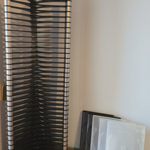CD case with 35 slots like new, includes 5 plastic storage boxes
