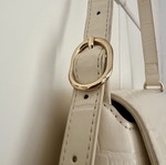Axel shoulder bag in ivory with croco texture