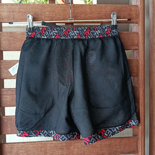McKenzie Shorts Swimwear new, black with red print, size 12-13 years
