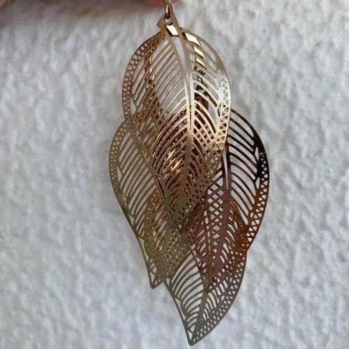 Accessorize metal gold feather earrings like new
