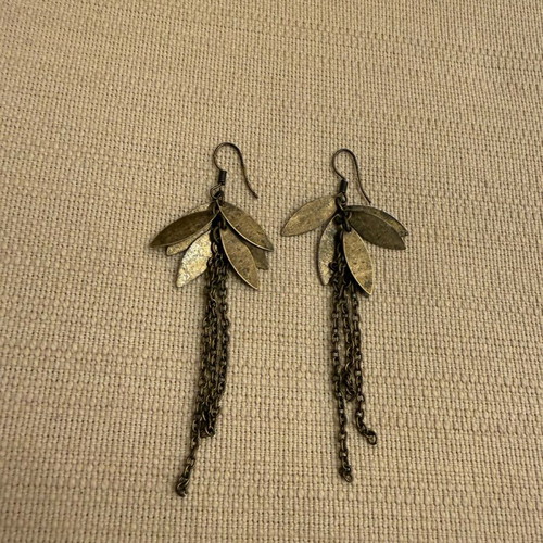 Dangling earrings lightly worn