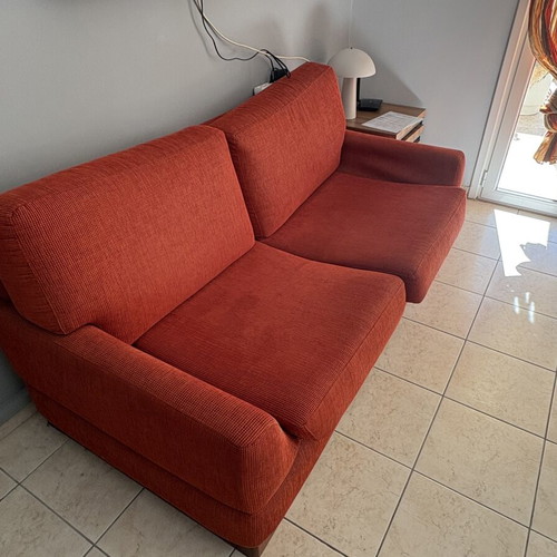 Orange sofa like new, comfortable and soft