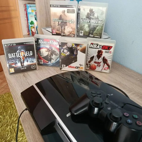PlayStation 3 console used with controller, charging cable and 6 games