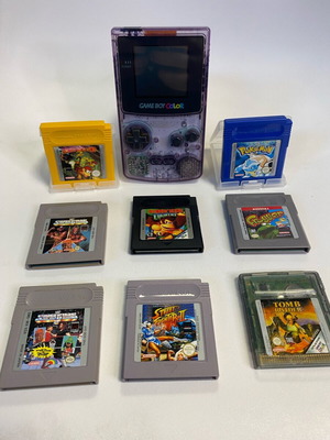 Game Boy Color console used with 8 games including Pokemon Blue, Donkey Kong, Street Fighter