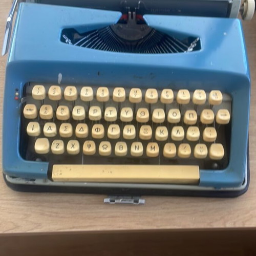 Brother Deluxe typewriter used, blue, Greek keyboard
