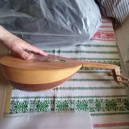 Mini tambouras used, wooden with crack