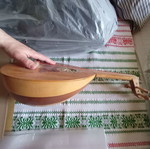 Mini tambouras used, wooden with crack
