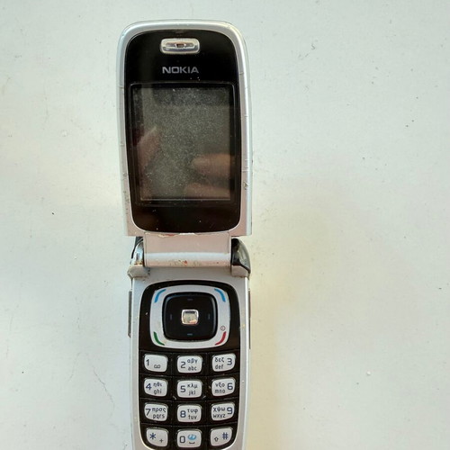 Nokia 6110 and 6103 vintage mobile phones used with chargers