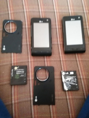LG KU 990i pack of two used working phones with button issue