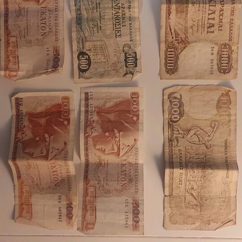 Greek and American paper money used