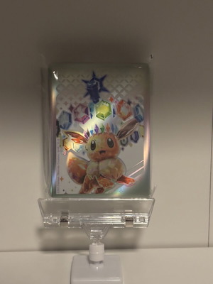 Pokémon TCG Prismatic Evolutions Stellar Tera Eevee card sleeves, 65 pack
