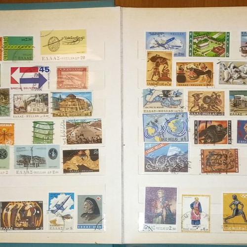 Book with collection of various Greek and foreign stamps used