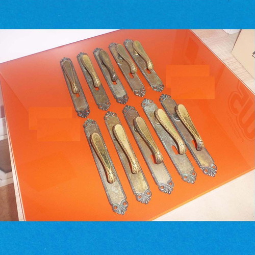 Metal door handles with antique decorative elements, set of 10 used